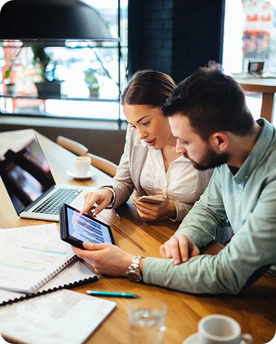 co-workers looking over financial details