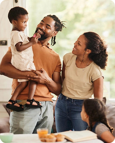 happy family smiling in their home