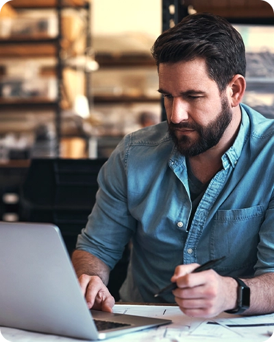 man looking at his computer