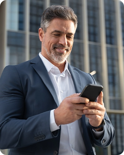 business man looking at phone