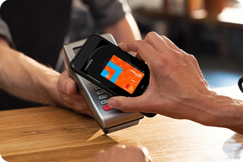 close up of someone using mobile wallet to pay