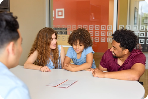 parents talking with daughter in Midland branch office