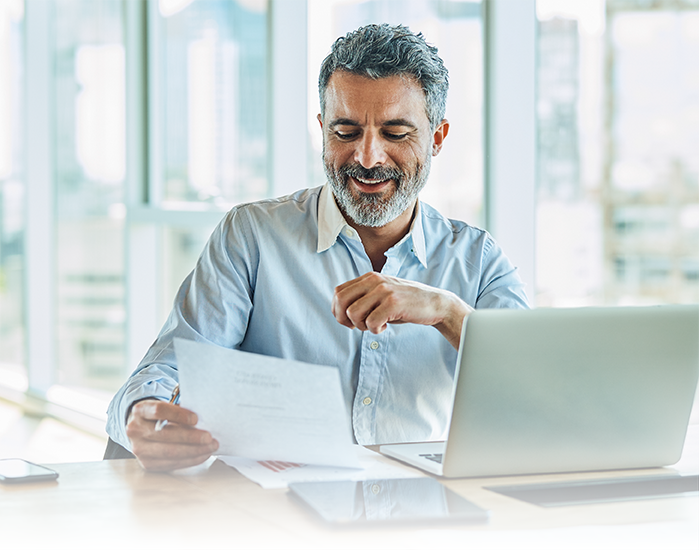 Business man holding papers